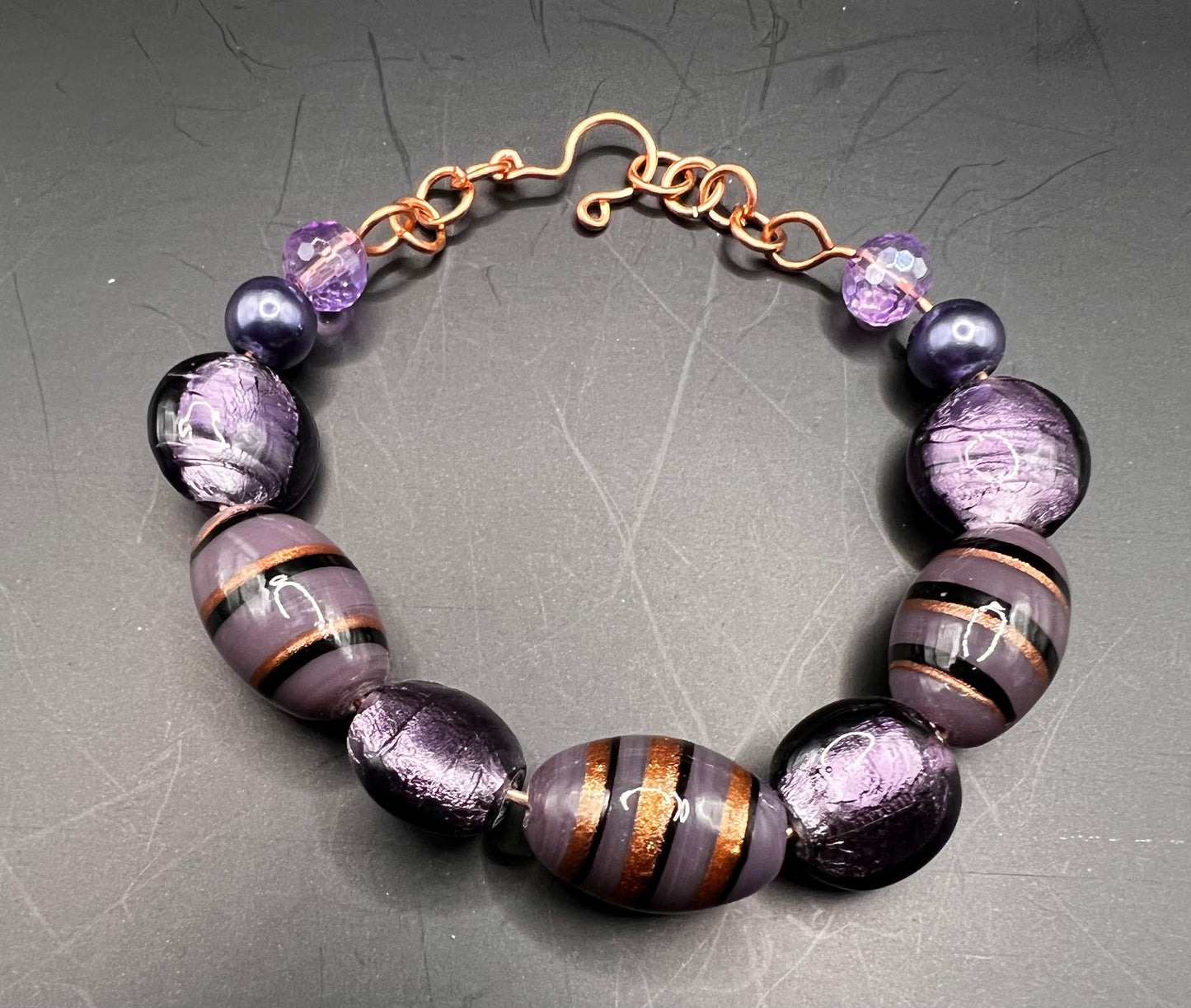 Copper cuff bracelet with large purple bead variations