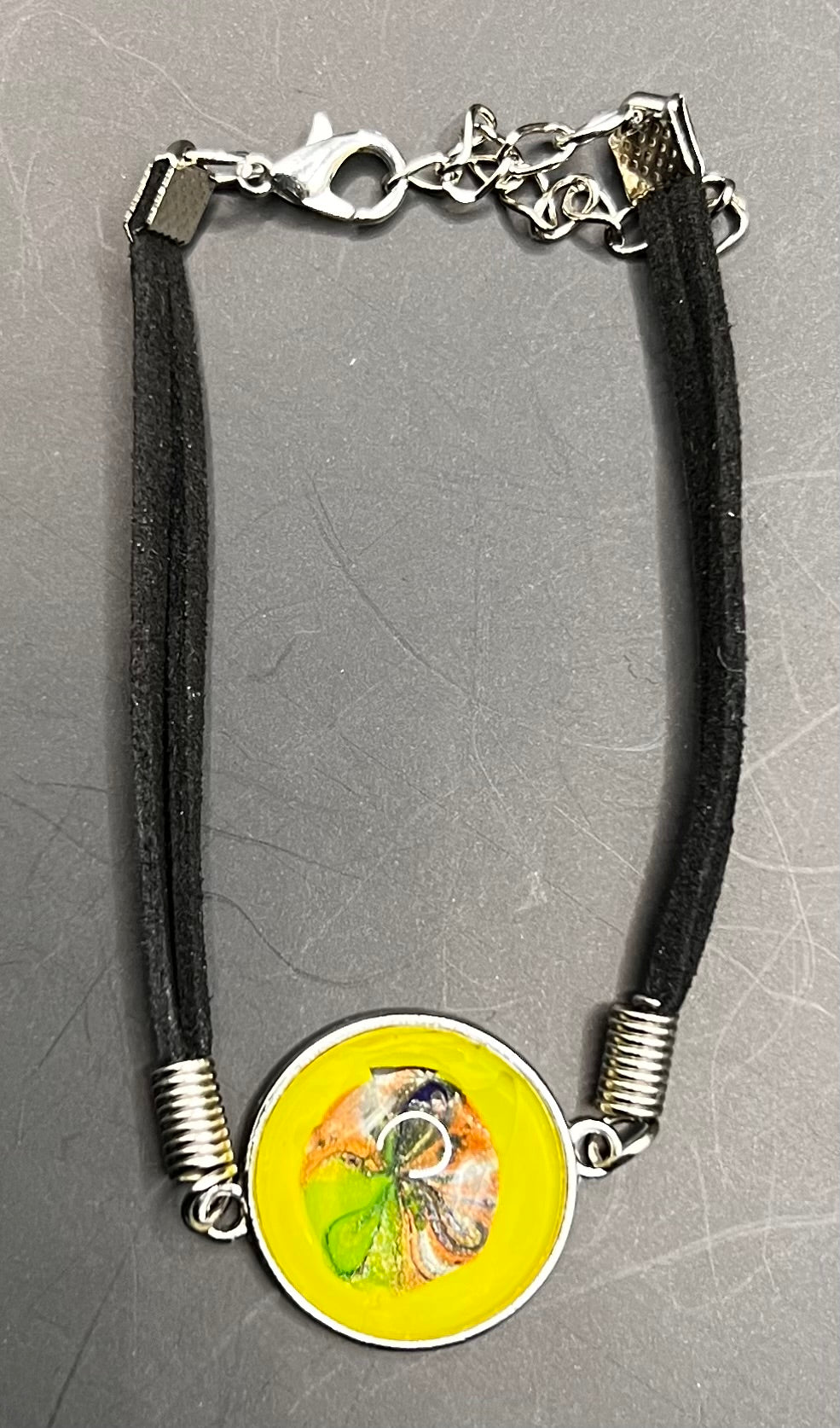 Yellow, green & orange round silver cabochon bracelet with black chord