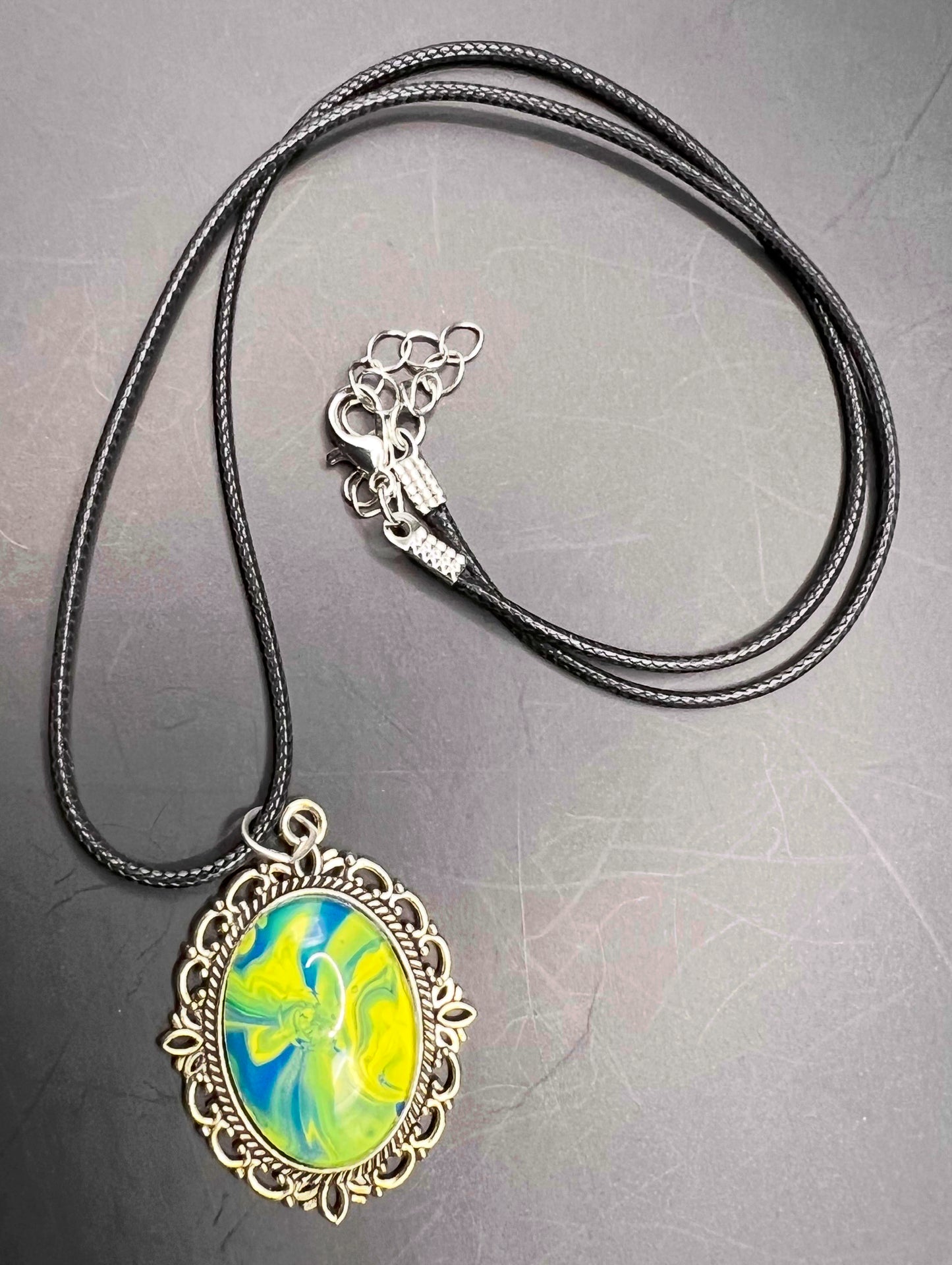 Blue and yellow with vintage looking gold cabochon necklace with black chord