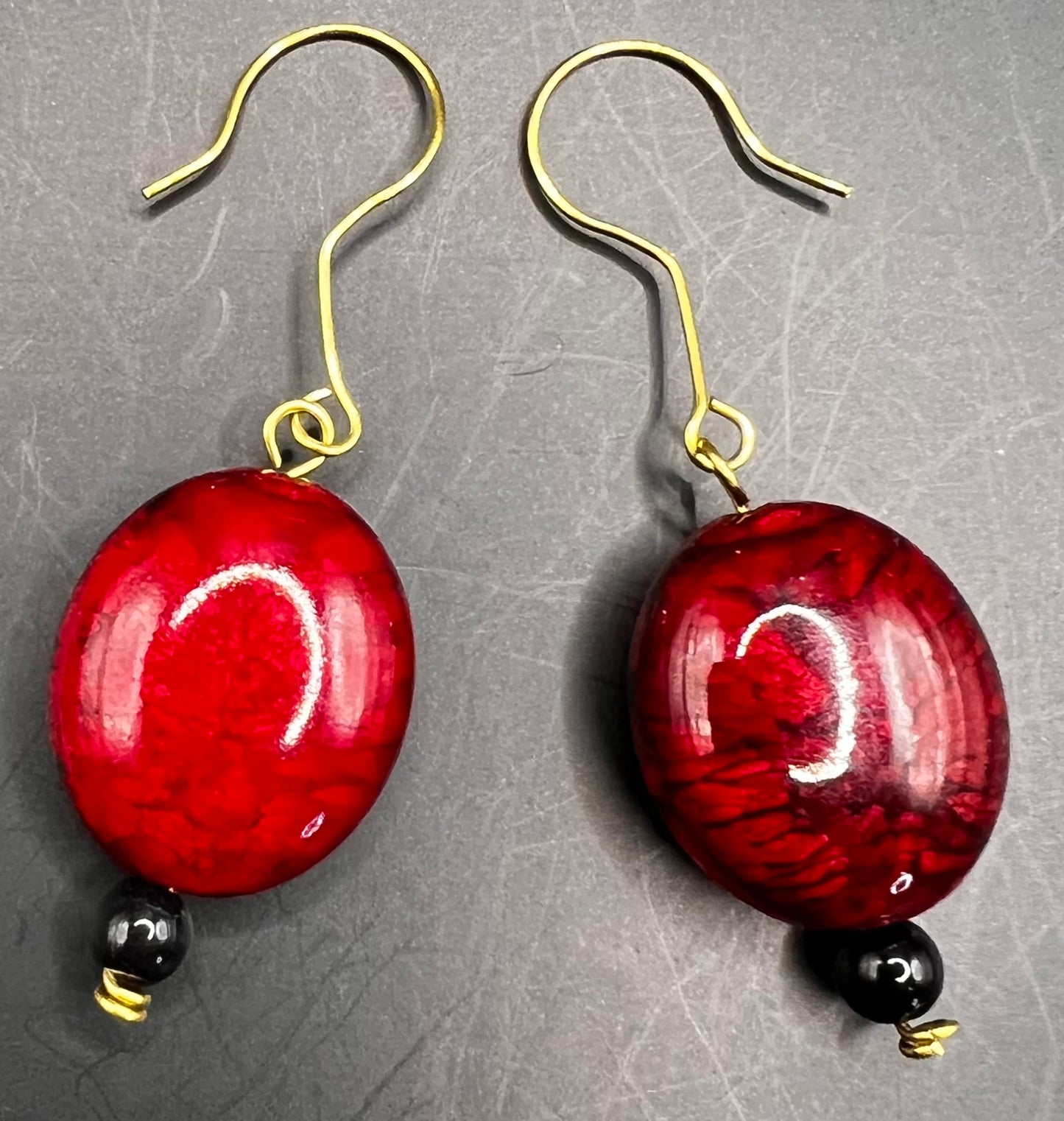 Gold earrings with Large Red & Black colored beads