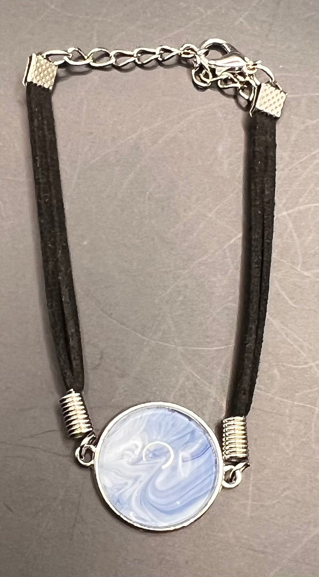 Blue & white round silver cabochon with black chord bracelet