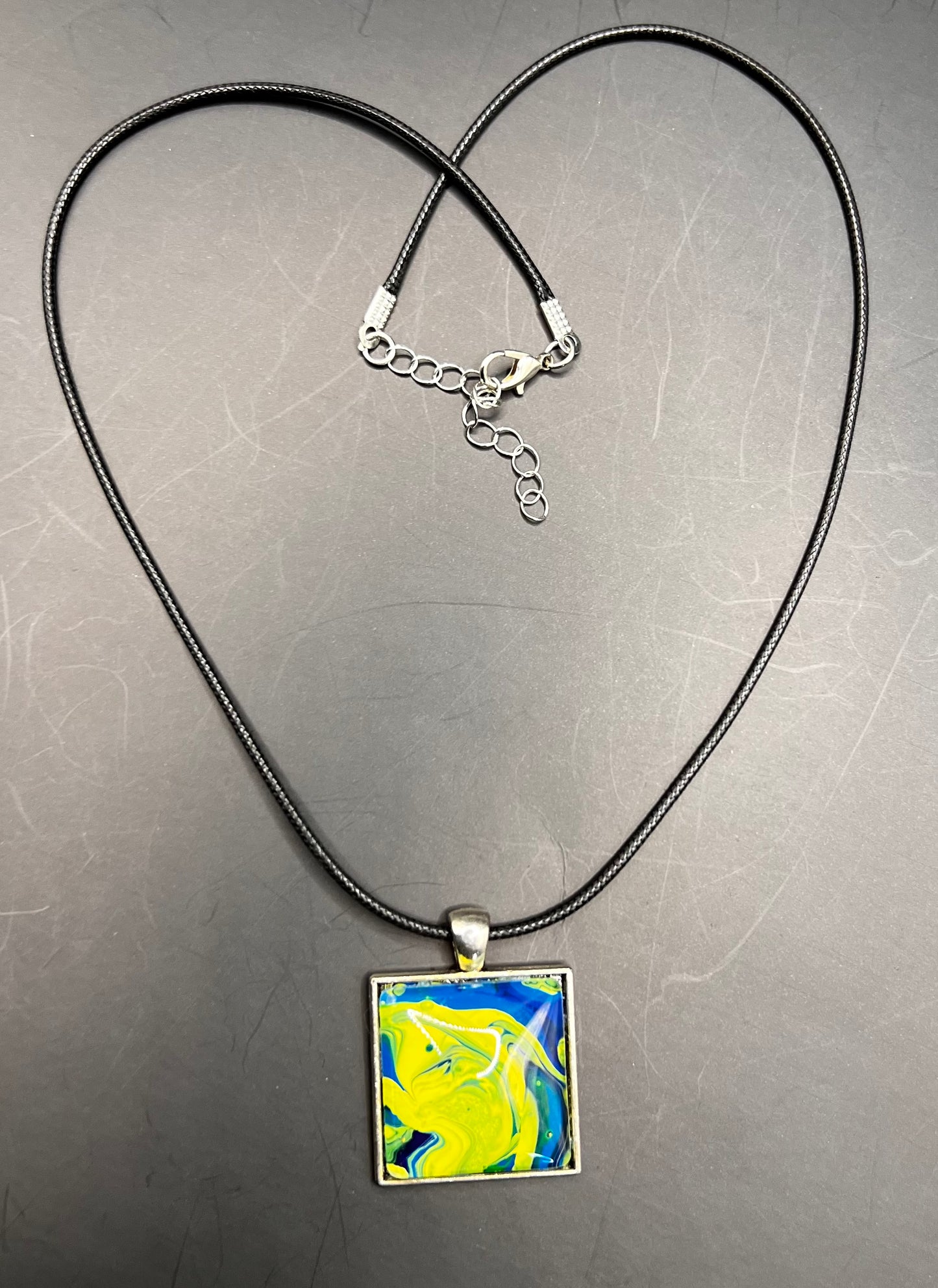 Blue & yellow square w/ silver back cabochon & black chord necklace