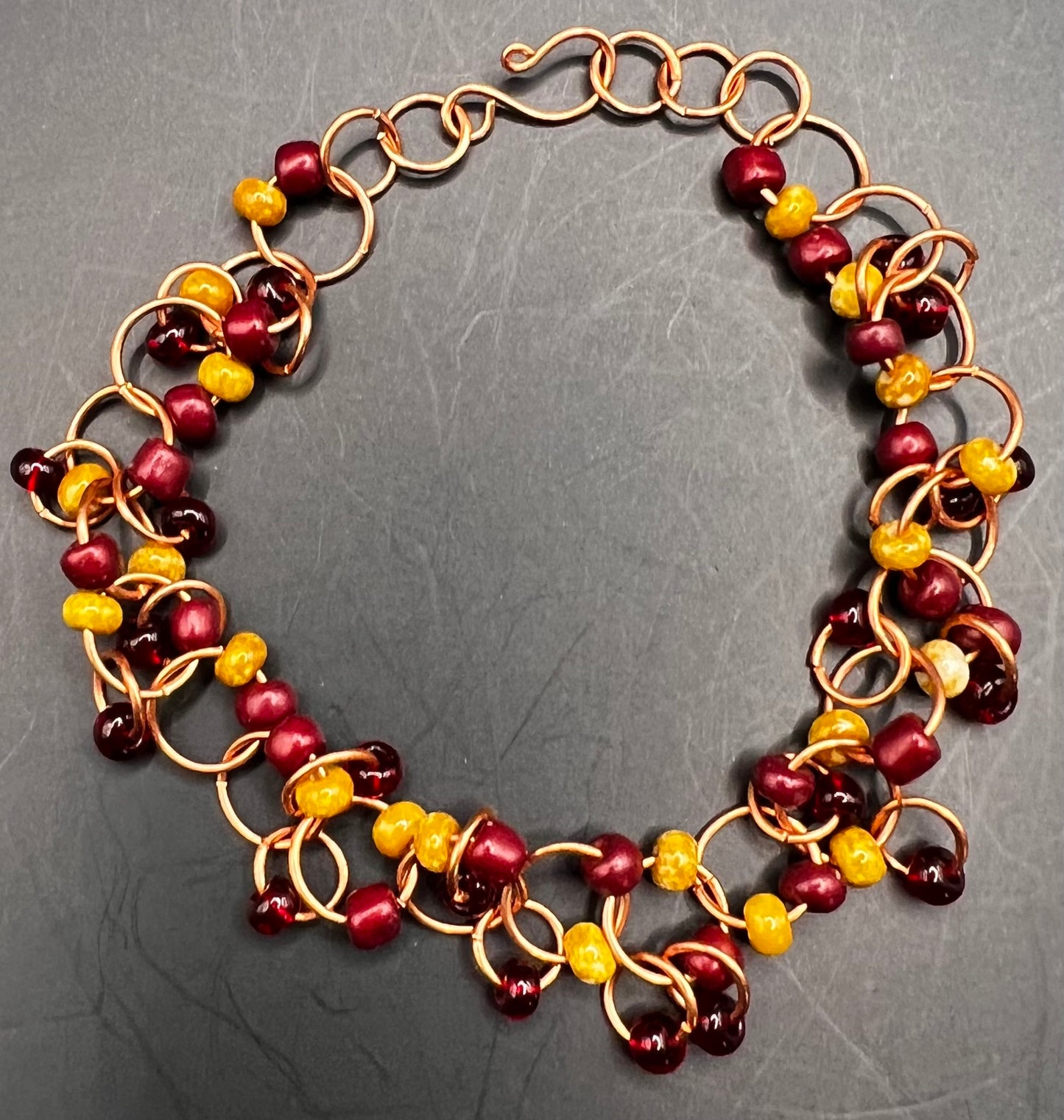 Copper ASU Bracelet with Abundant Hoops with Maroon & Gold Seed Beads