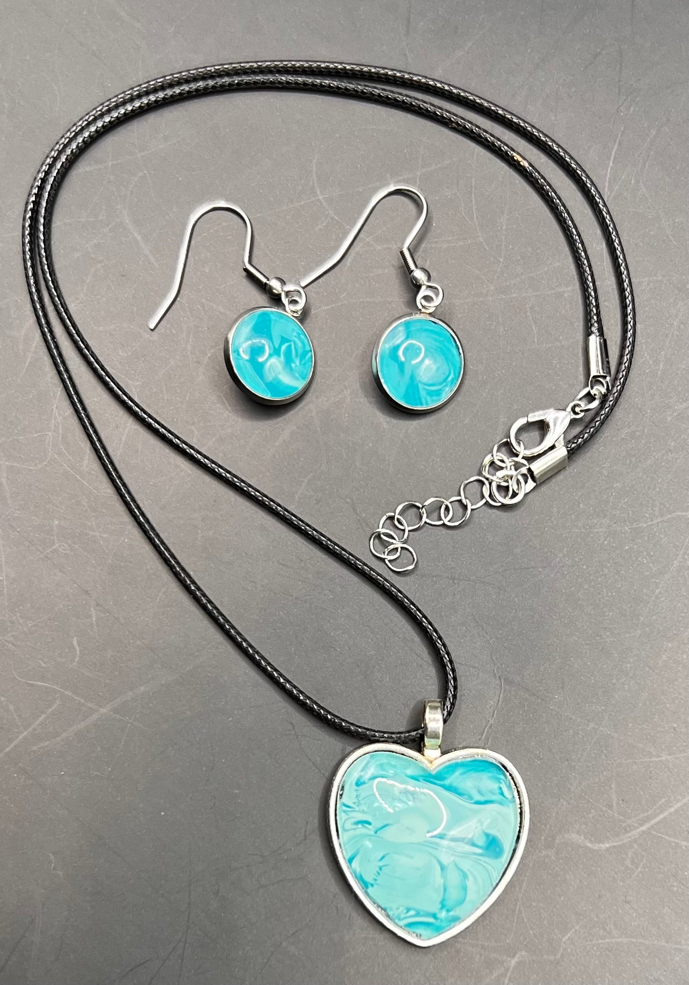 Teal Heart w/ teal round cabochon w/ black chord