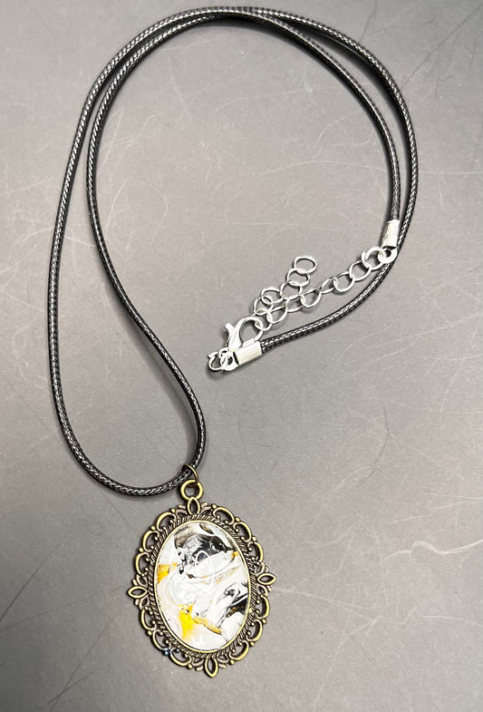 Black, Gold and white with vintage looking gold cabochon necklace with black chord