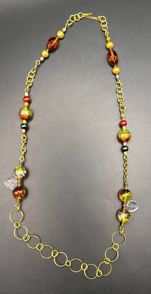 Autumnal Gold necklace with hoops and hints of green, orange, and yellow/gold & leaves