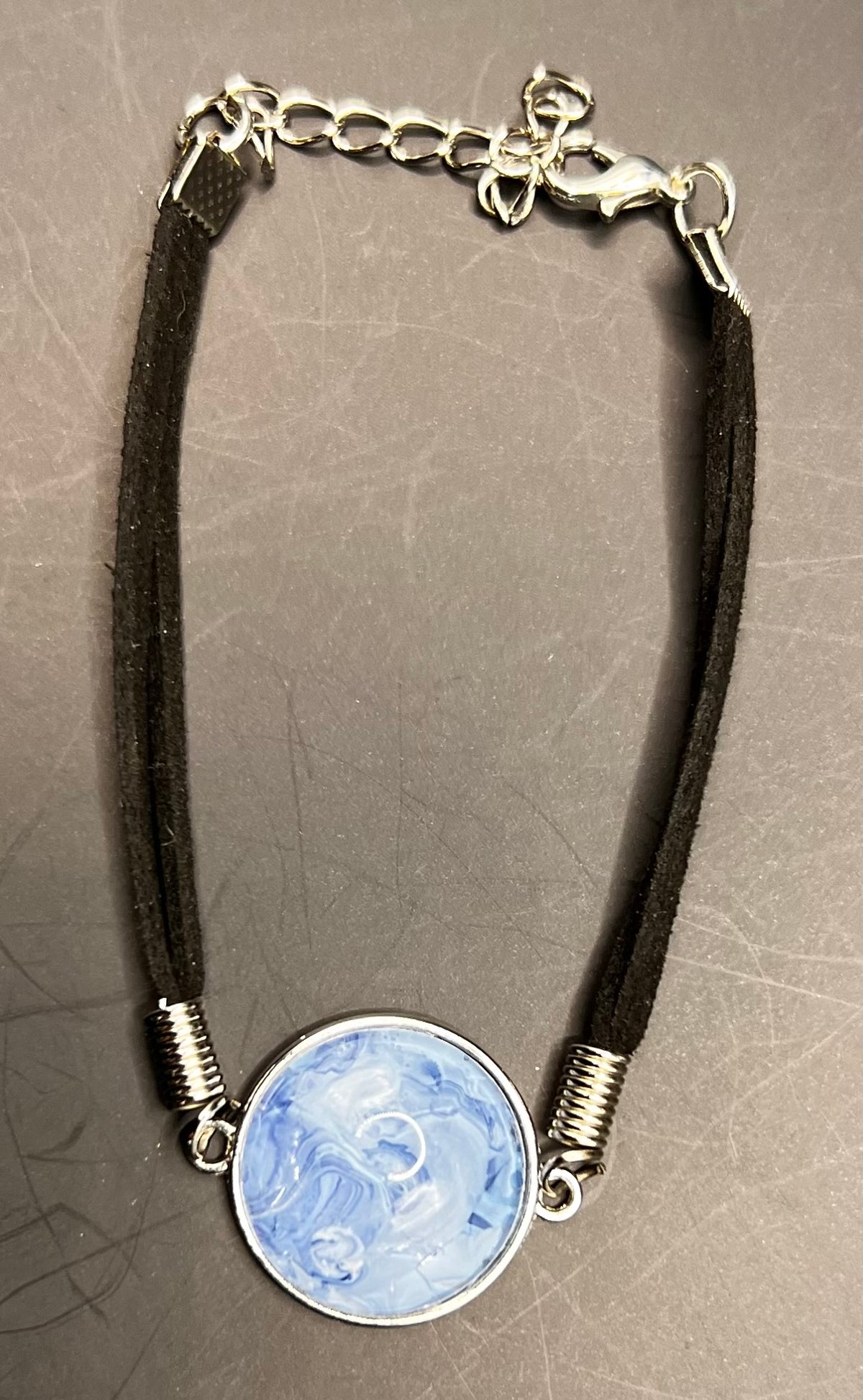 Blue & white round silver cabochon with black chord bracelet