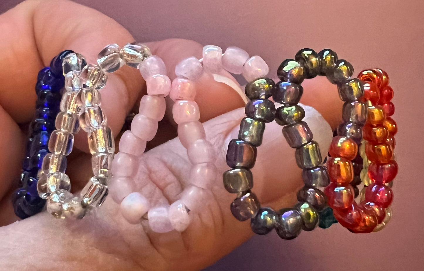 Multicolored loops w/ seed beads & coils. Cuffed silver bracelet