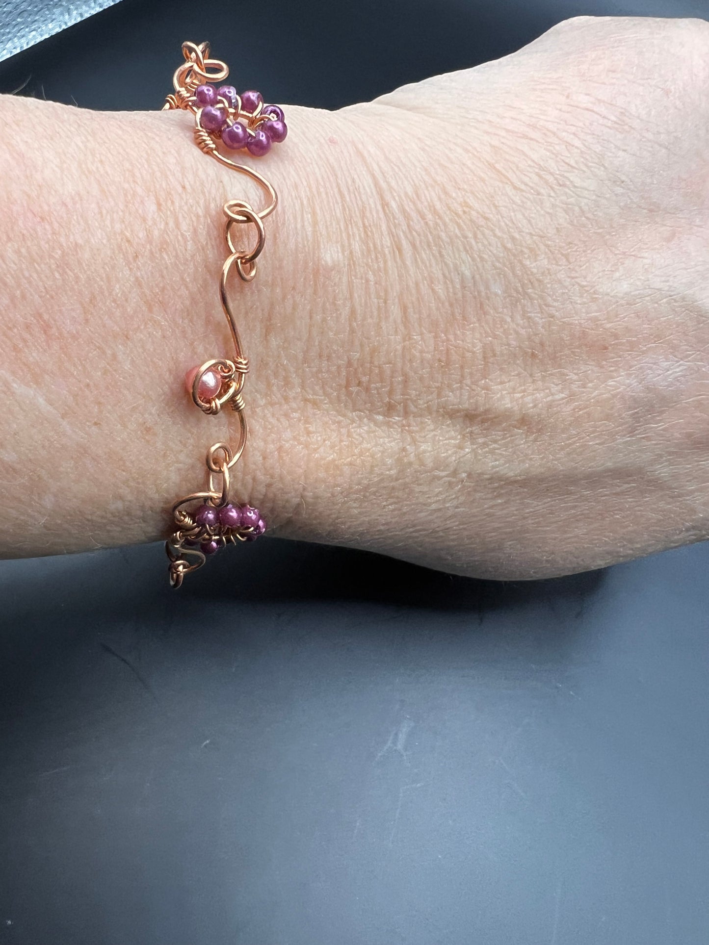 Copper bracelet with delicate designs & beads