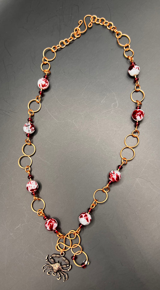 Copper hoops and infinity necklace with red beads & crab pendant