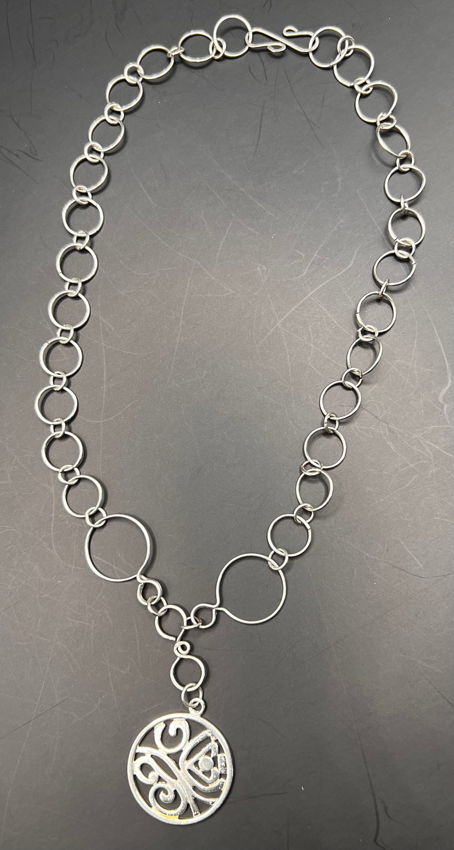 Silver multi-sized hoops necklace w/ silver pendant