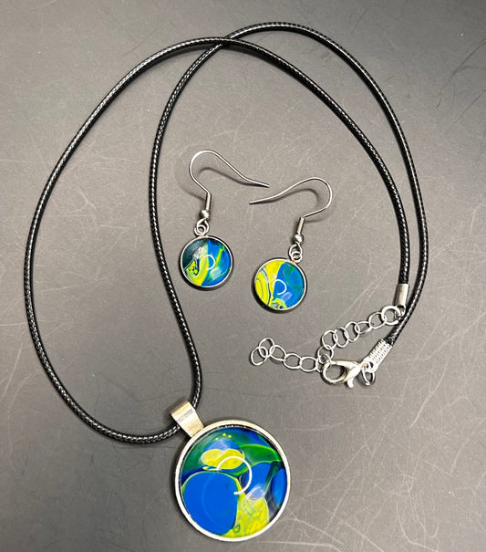 Blue & yellow round silver cabochon w/ black chord