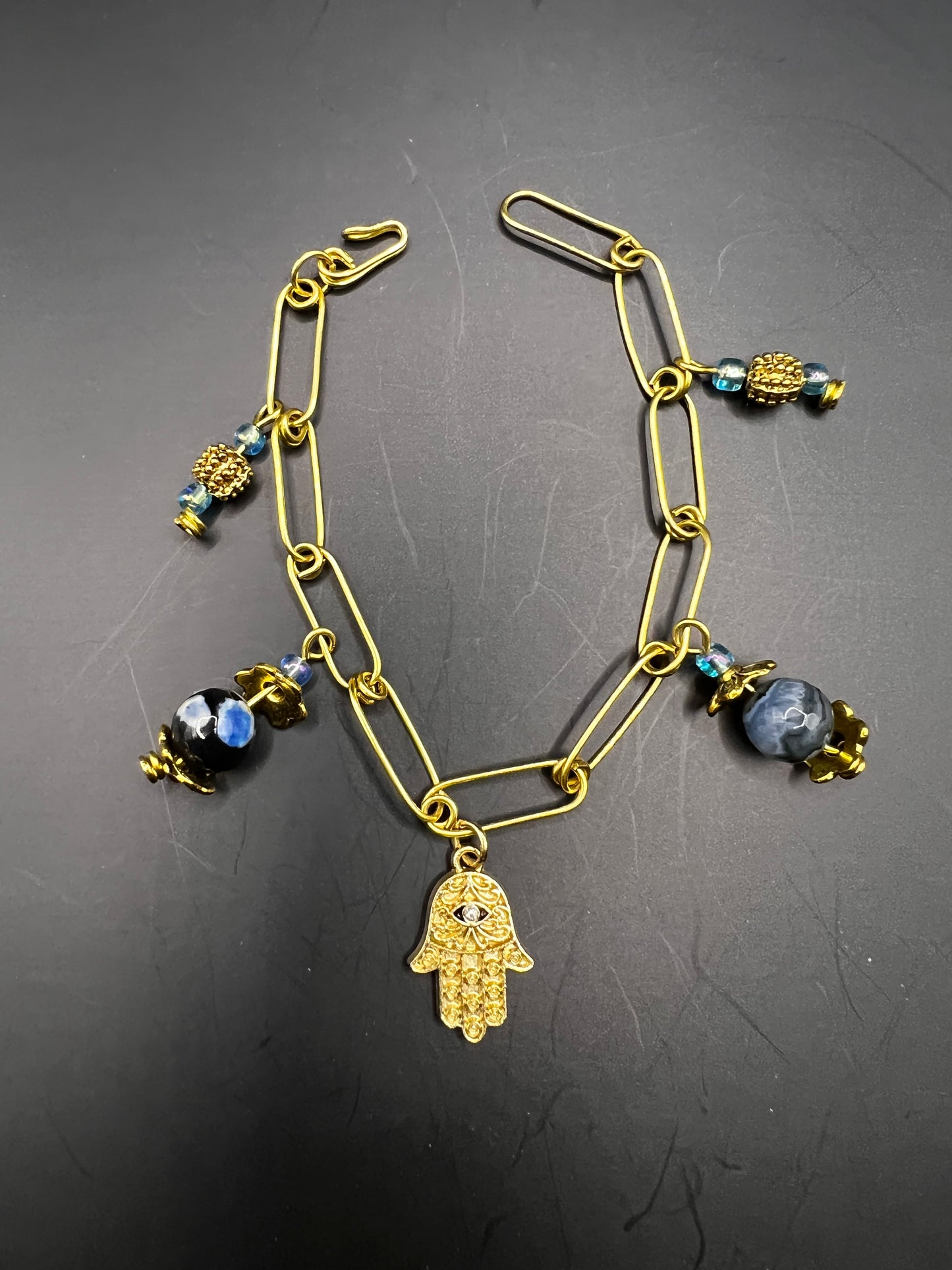 Gold elongated links with blue charms & Hamsa Hand embellishment charm