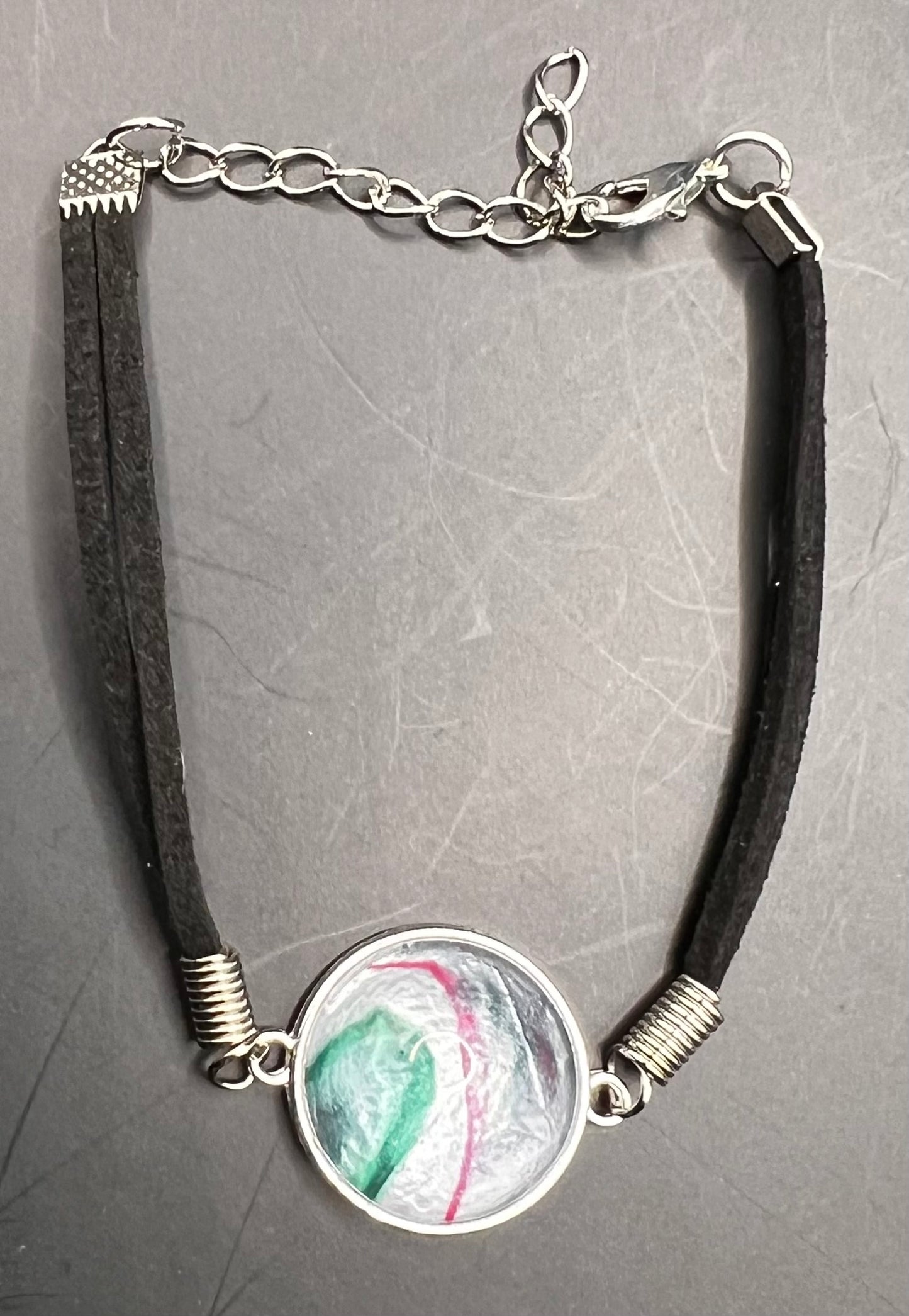 Green, silver, & pink round cabochon bracelet with black chord