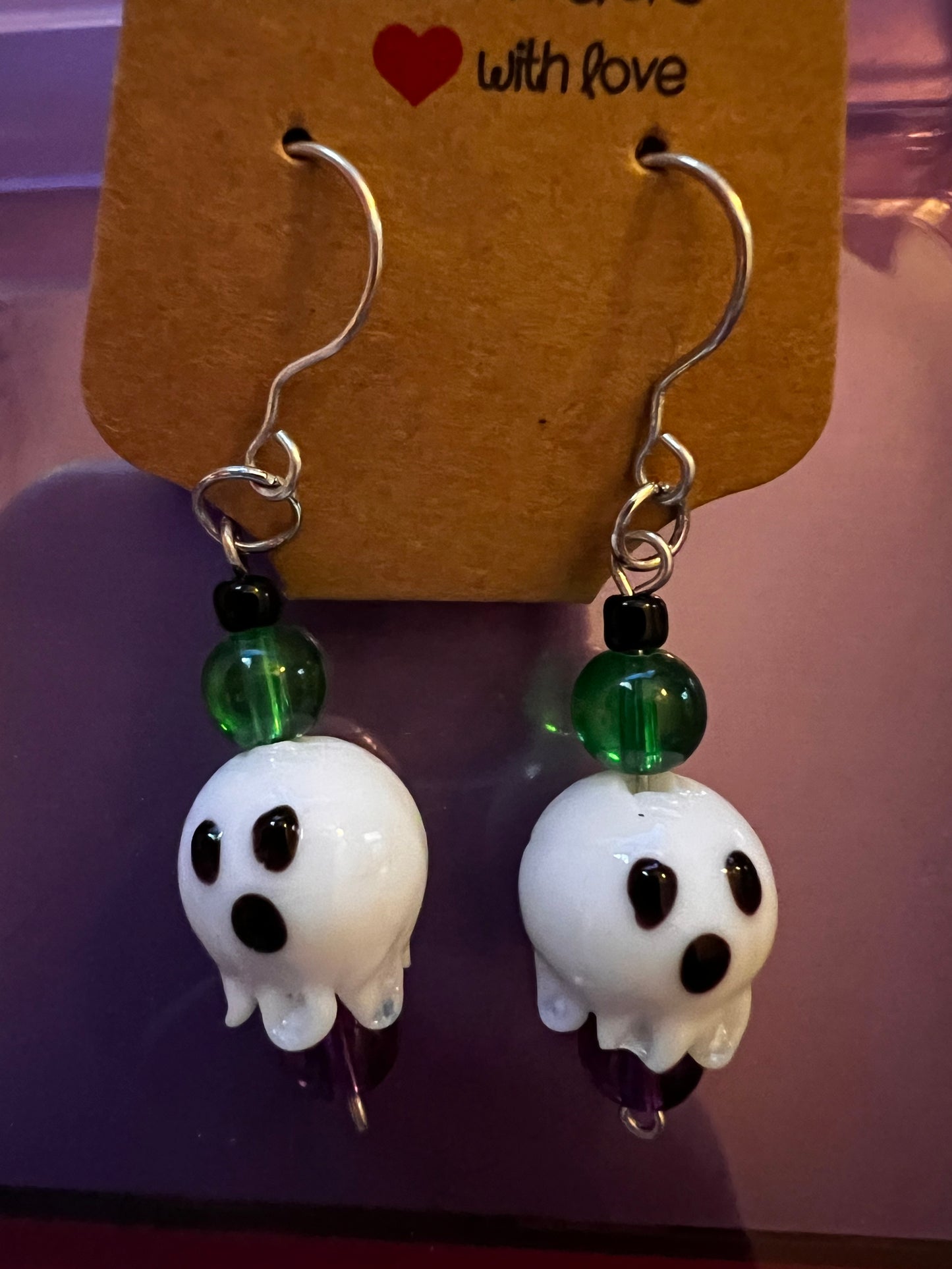 Gold dangle earrings with ghosts & green, purple & black beads